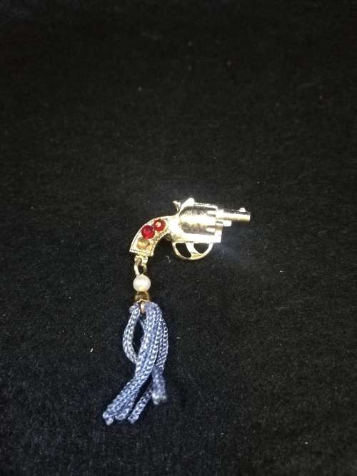 Cute revolver brooch