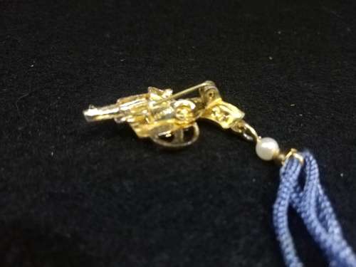 Cute revolver brooch