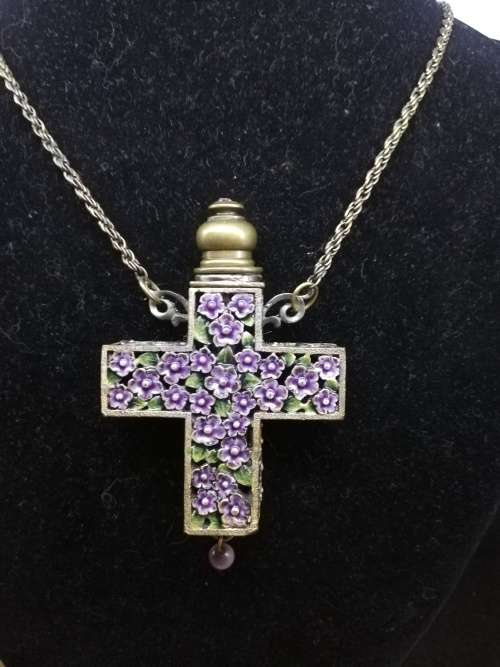 Beautiful vintage look cross with perfume bottle on long chain