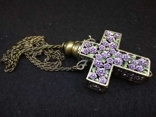 Beautiful vintage look cross with perfume bottle on long chain