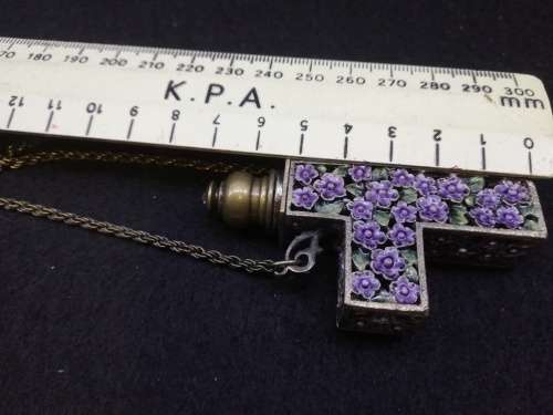 Beautiful vintage look cross with perfume bottle on long chain