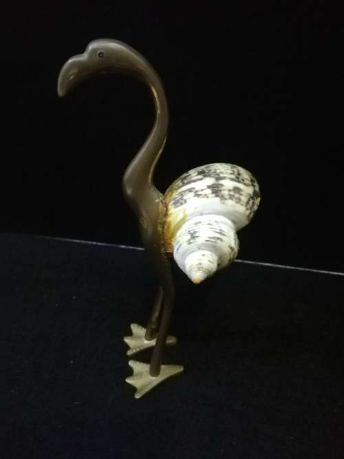 Brass bird with shell body