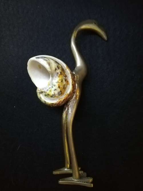 Brass bird with shell body
