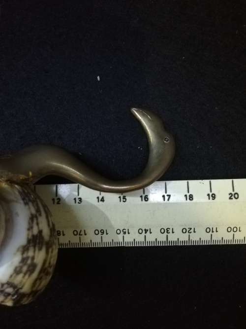 Brass bird with shell body