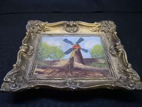 Cast metal frame and painting