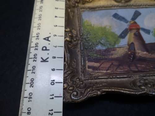 Cast metal frame and painting