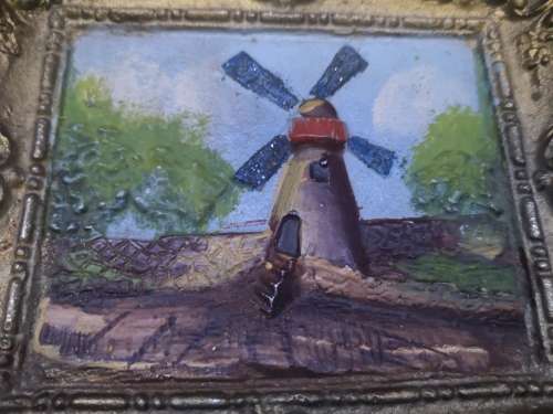Cast metal frame and painting