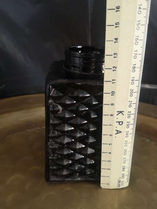 Black milk glass bottle