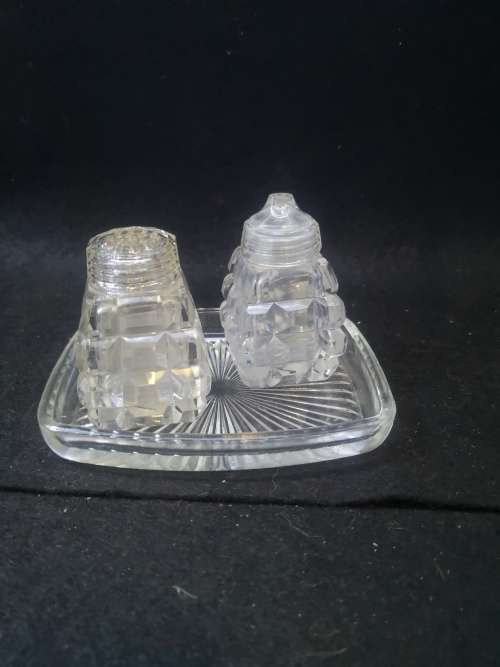 All glass salt and pepper on glass tray