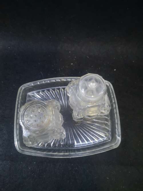 All glass salt and pepper on glass tray