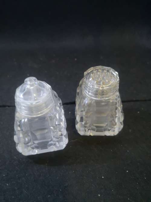 All glass salt and pepper on glass tray