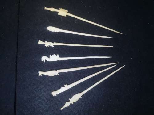 Looks like handmade cocktail/toothpicks