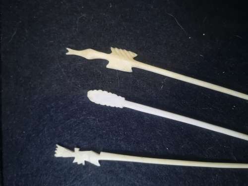 Looks like handmade cocktail/toothpicks