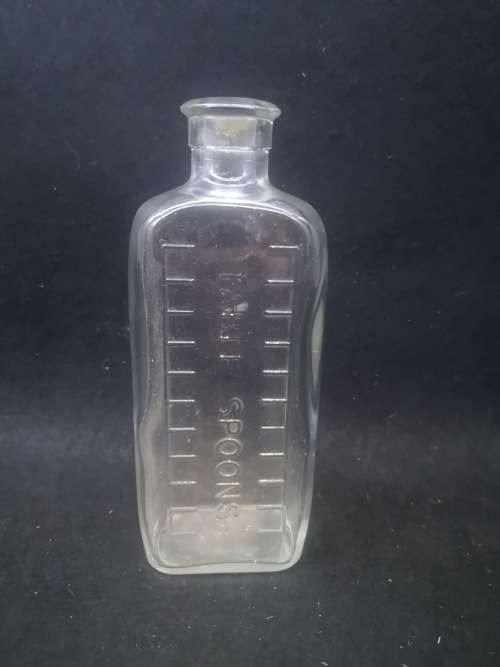 Table spoon measured medicine bottle