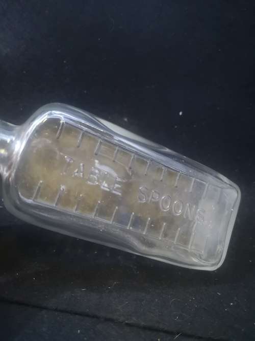 Table spoon measured medicine bottle