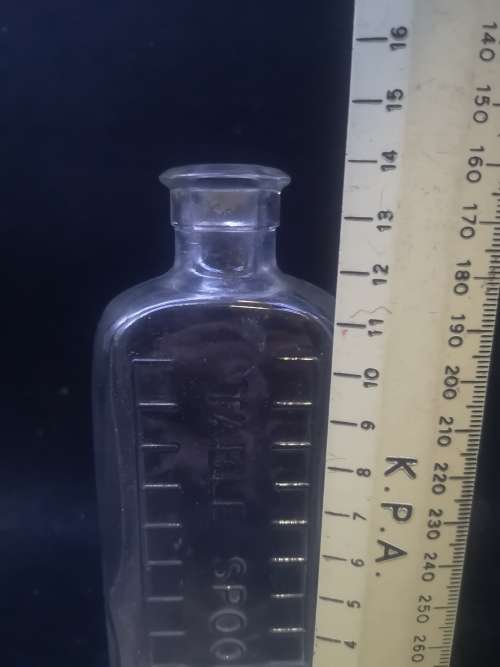 Table spoon measured medicine bottle