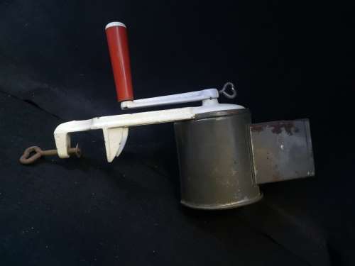 Very well used old grater - with table clamp