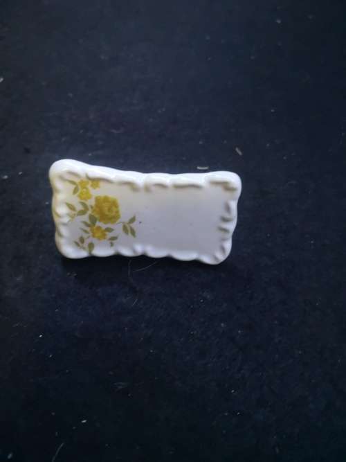 Yellow porcelain name placements