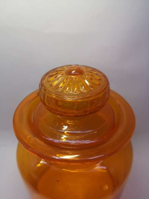 Medium Bright orange glass bottle and glass lid