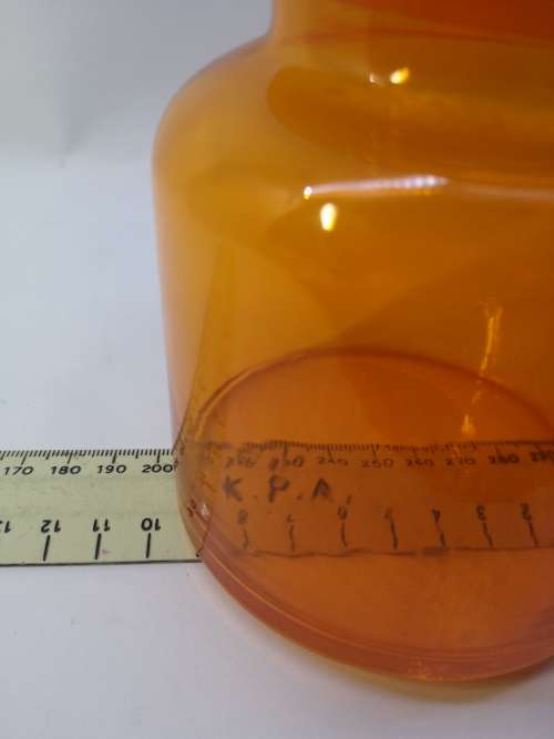 Small Bright orange glass bottle and glass lid