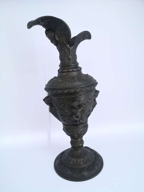 Antique style ewer with embossed Cherubs