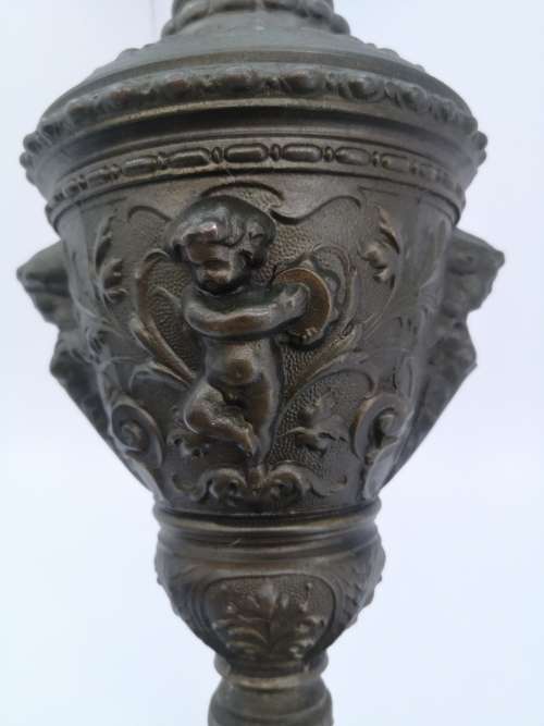 Antique style ewer with embossed Cherubs