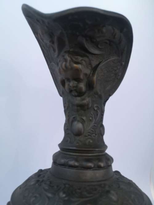 Antique style ewer with embossed Cherubs