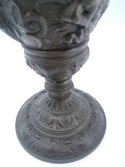Antique style ewer with embossed Cherubs