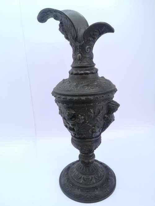 Antique style ewer with embossed Cherubs