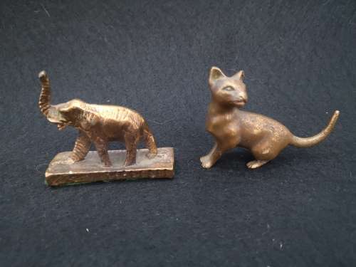 Mini bronze elephant and a cat