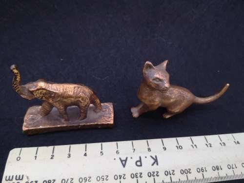 Mini bronze elephant and a cat