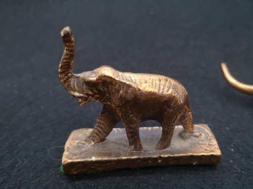 Mini bronze elephant and a cat