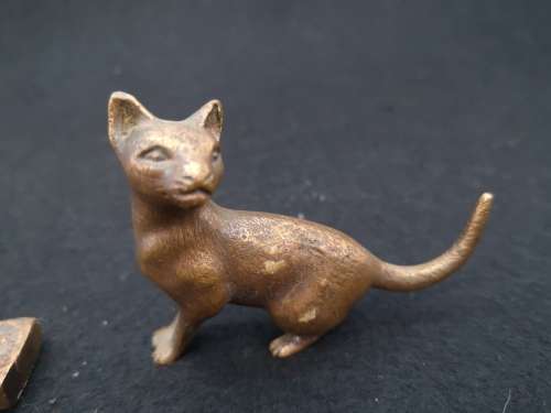 Mini bronze elephant and a cat