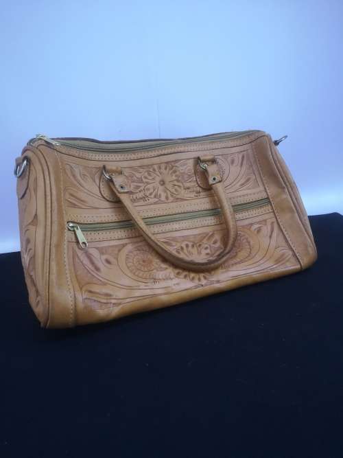 Hand crafted leather handbag with shoulder strap