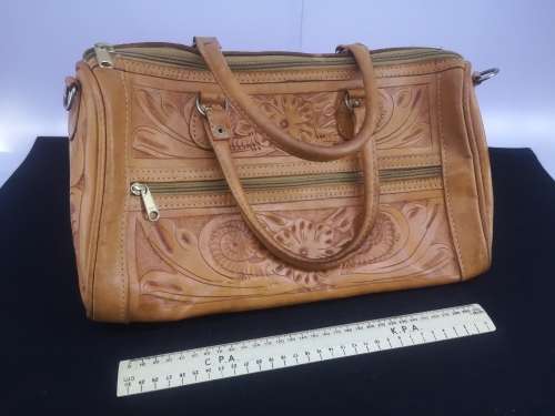 Hand crafted leather handbag with shoulder strap