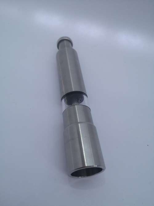 Pump action salt or pepper grinder