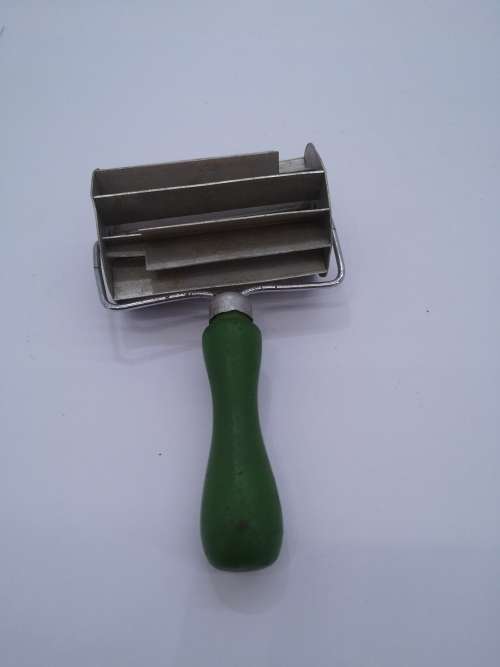 Vintage green wooden handle koeksister cutter