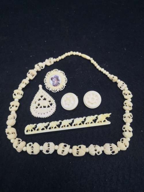 Collection of bone jewelry - Brooch, pendant, necklace and clip on earrings