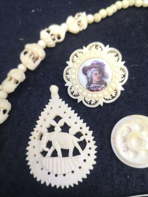 Collection of bone jewelry - Brooch, pendant, necklace and clip on earrings