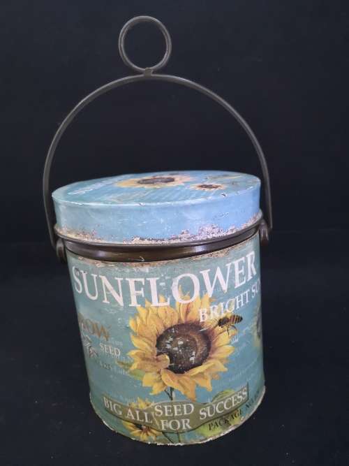 Sunflower seed tin with handle