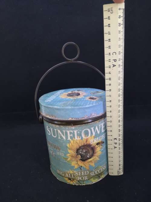 Sunflower seed tin with handle