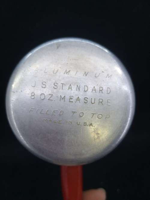 Aluminum measurement cup with wooden handle