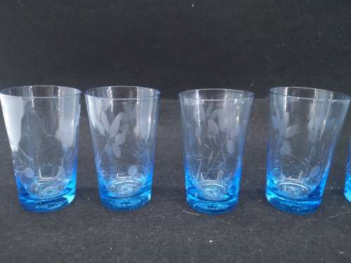 Turquoise liquor/shot glasses - one has two fleabites