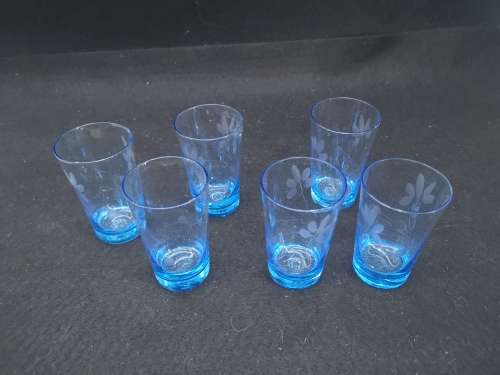 Turquoise liquor/shot glasses - one has two fleabites