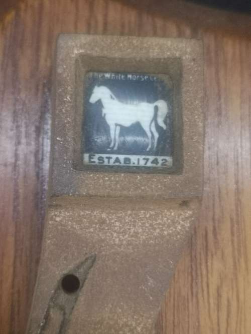 White Horse whiskey horse shoe plaque