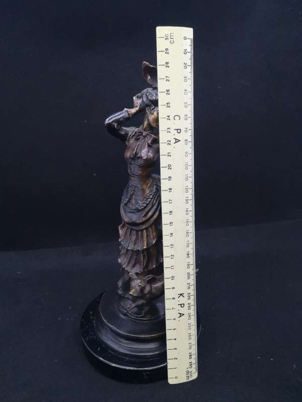 Heavy cast metal woman with sausage dog