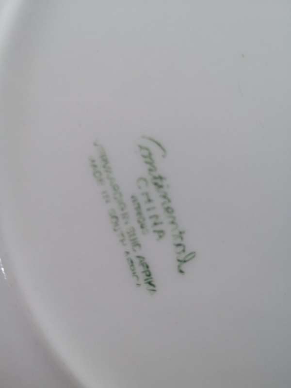 Continental China green dinner plates