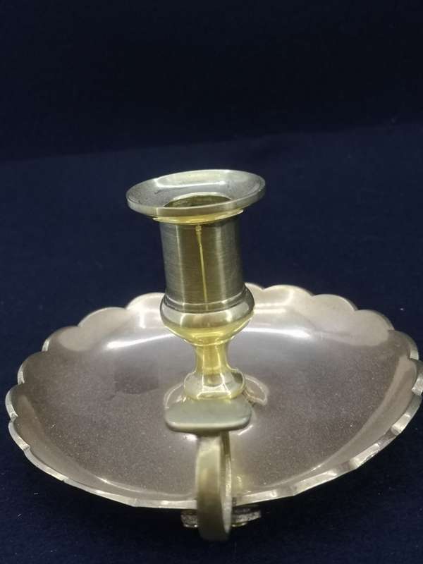 Solid antique brass candle holder/chamber stick