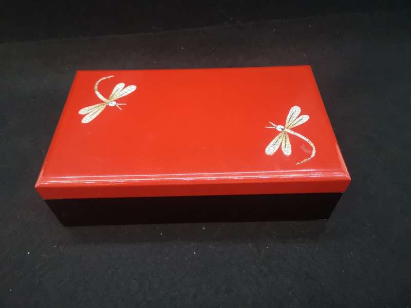 Vintage red lacquer jewelry box with dragonfly detail