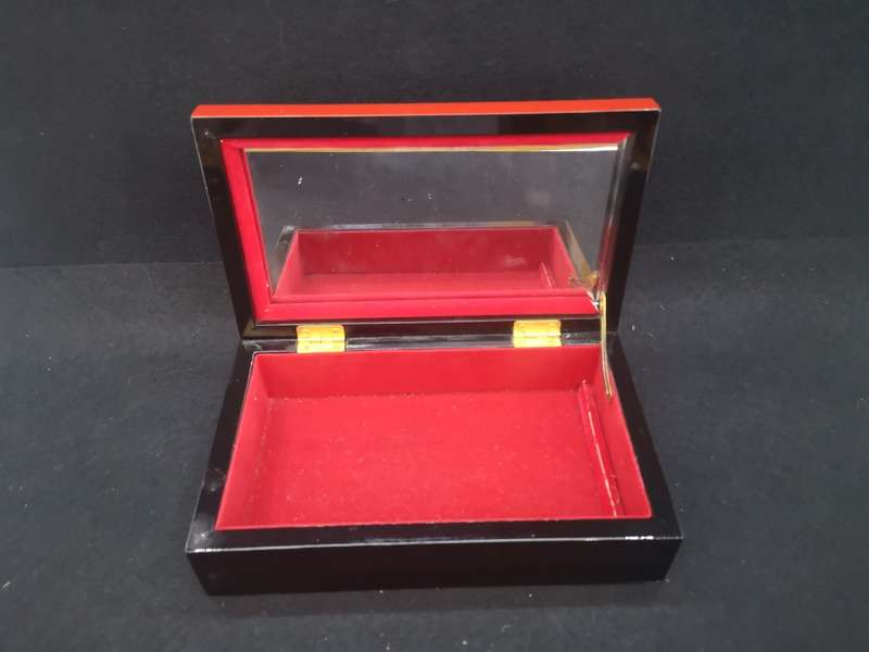 Vintage red lacquer jewelry box with dragonfly detail